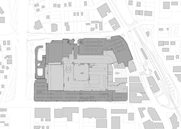 Lageplan der Anlage, die direkt am Bahnhof liegt. Dunkel: das Parkhaus.