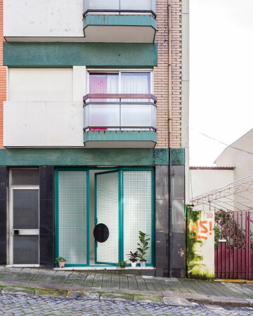 Refurbishment  a thirty meters long gleeful abstraction backed up with a patterned floor and a flying kitchen